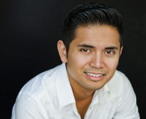 Photo features headshot of Wilfred Paloma