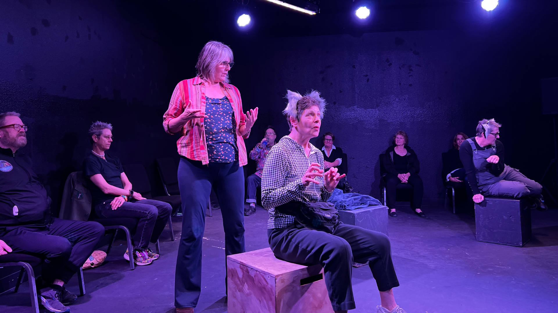 Photo Features Stonewall Salon Participants performing with each other in the black box theatre