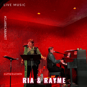 Live music with ria and rayme. Photo features ria and rayme on the cabaret stage