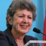 Lillian Faderman smiling in front of a microphone