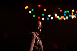 a person standing in front of a group of lights